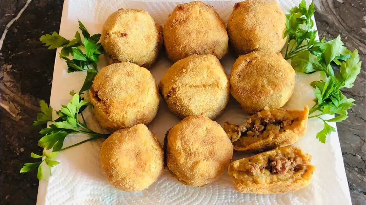 Crispy golden Moroccan Maakouda potato patties with fresh lemon and parsley